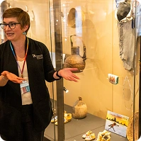 photograph of Alex Greenwald, curator of ethnography, talking about the display of Indigenous items at the Natural History Museum of Utah.
